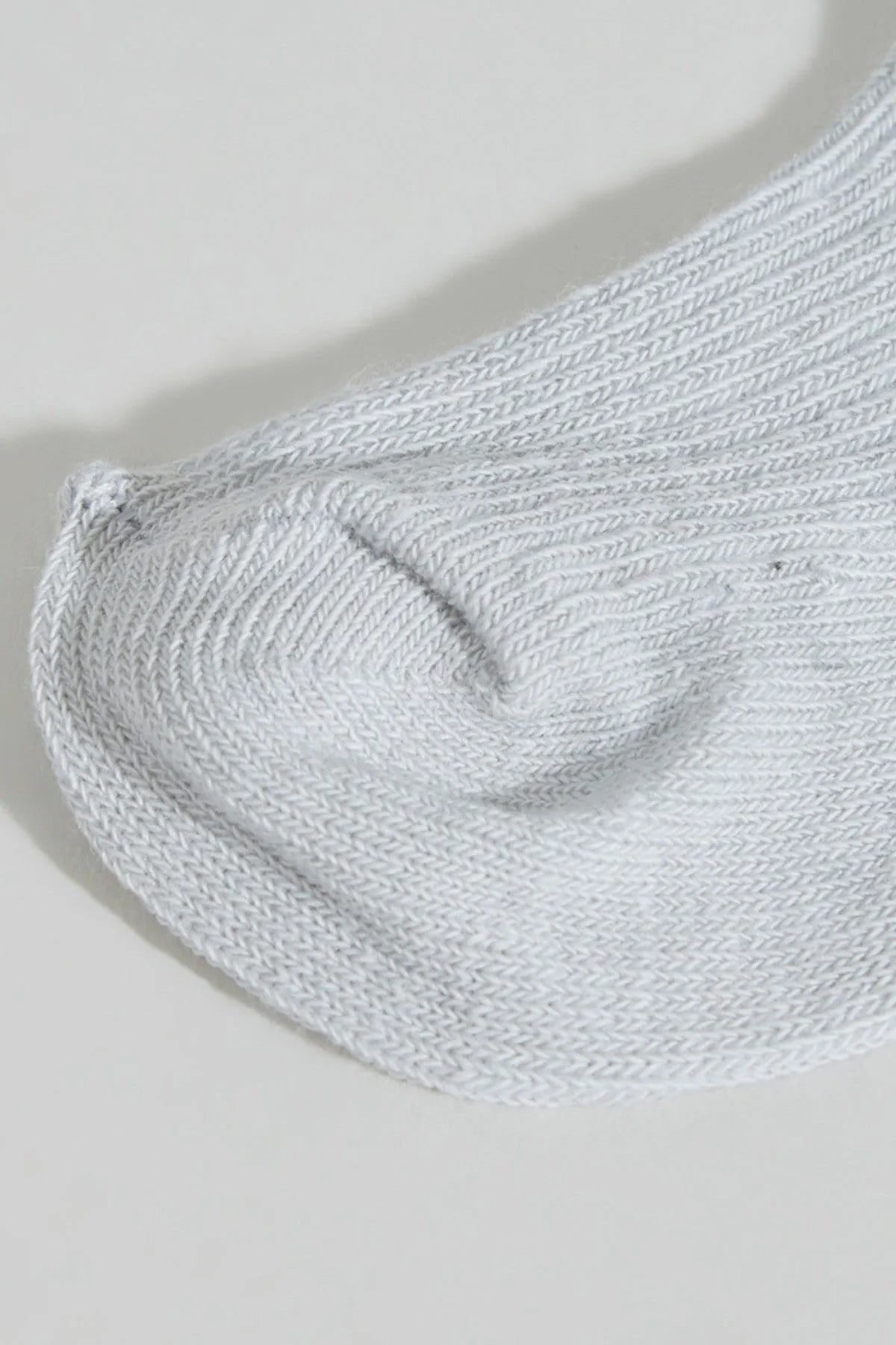 BABYSHOP baby sock, light gray close-up of ribbed knit toe and heel