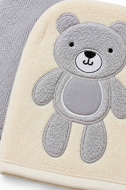 Cream baby blanket with gray teddy bear applique