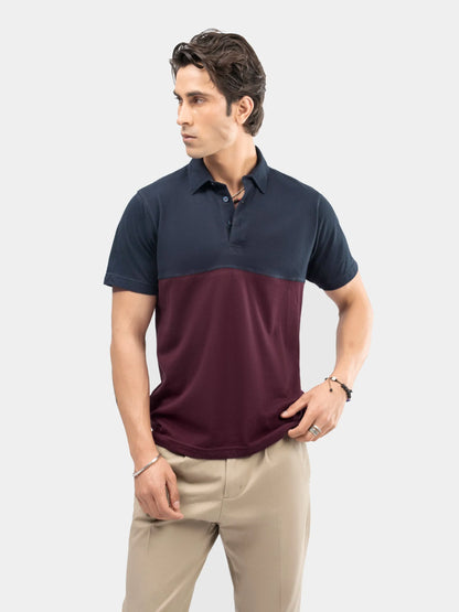 Color-block polo shirt with navy shoulders and collar, burgundy body, short sleeves