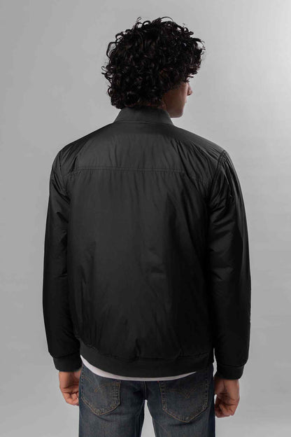 Black bomber jacket back view with zip front and ribbed hem and cuffs