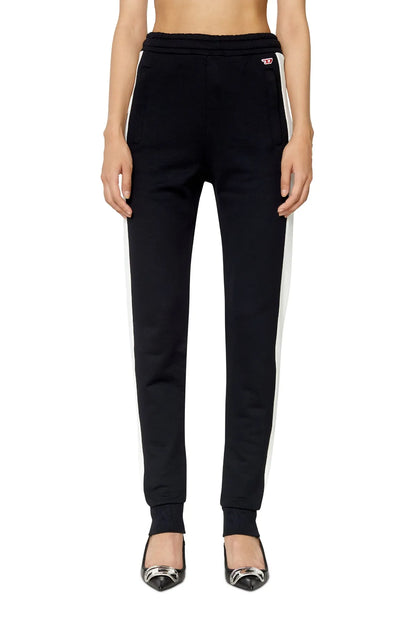 Black tapered track pants with white side stripes and elastic cuffs