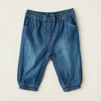 Baby blue denim pants with elastic waist, drawstring and patch pockets