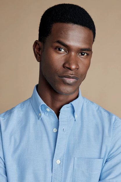 Men's light blue short-sleeve button-up shirt, front view with button-down collar