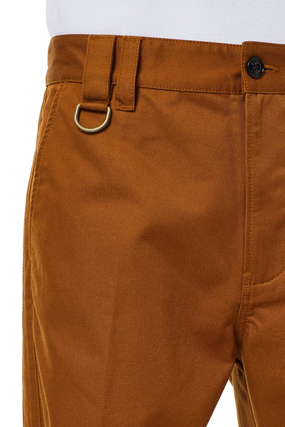 Men's light brown pants close-up: waist with metal ring and button placket