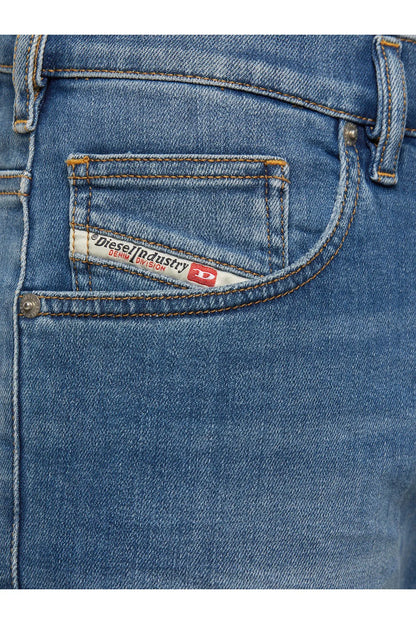 Blue denim jeans pocket with contrast stitching and logo patch