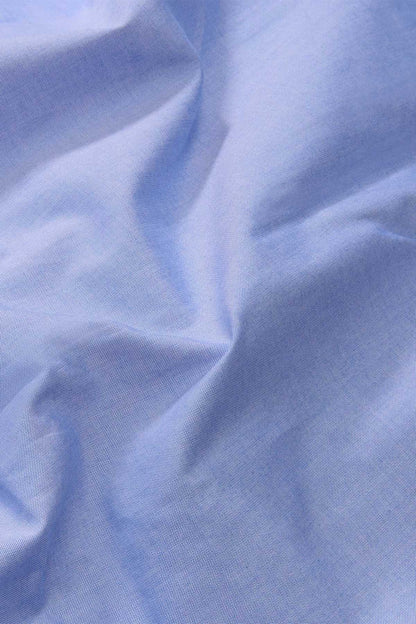 Light blue dress shirt fabric close-up