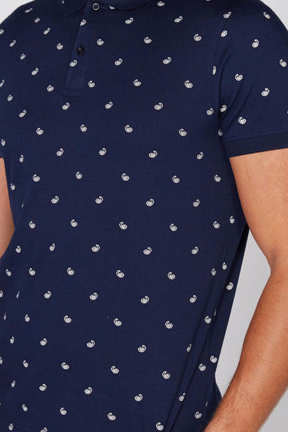 Navy polo shirt with repeating small white graphic print, button-front collar