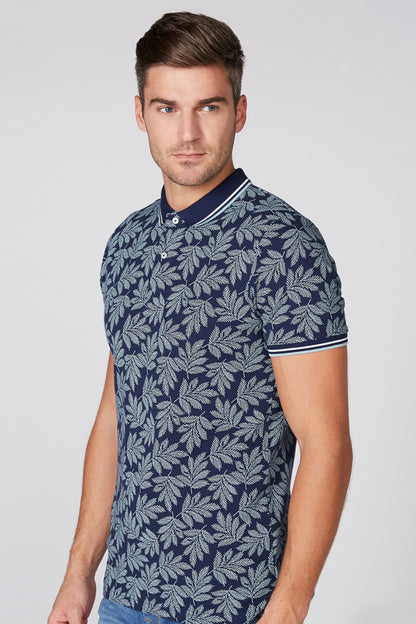 Navy leaf-print polo shirt with striped collar and button placket