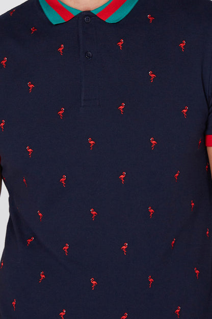 Navy polo shirt close-up: teal collar with black buttons, red figure print