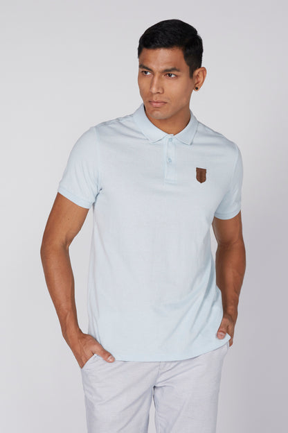 Light blue polo shirt with button placket and chest logo patch