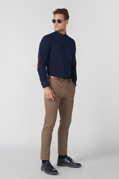 Navy zip-front jacket with stand collar, worn with tan pants