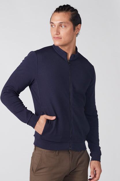 Men's navy zip-up jacket with stand collar and long sleeves