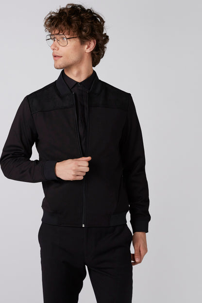 Men's black zip-up jacket with stand collar, chest flap pockets, full zipper