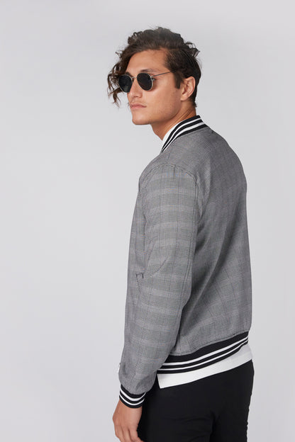 Men's grey plaid zip-front jacket, side view with striped ribbed cuffs