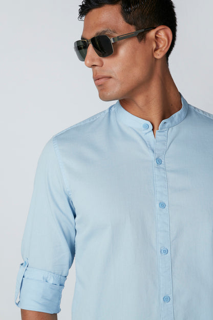 Light blue button-up dress shirt, long sleeves with button cuffs and collar