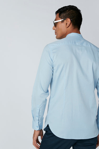 Light blue button-up dress shirt back view, long sleeves and button collar