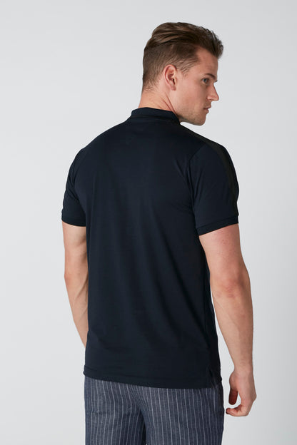 Men's dark navy polo shirt, back view with short sleeves and collar