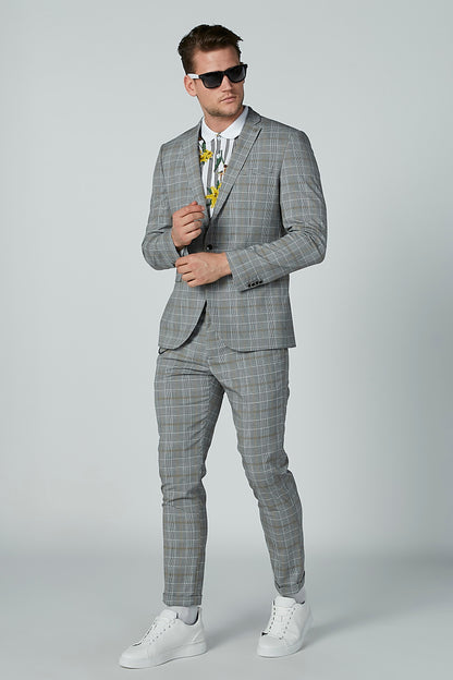 Men's floral striped short-sleeve shirt worn under grey plaid suit jacket and trousers