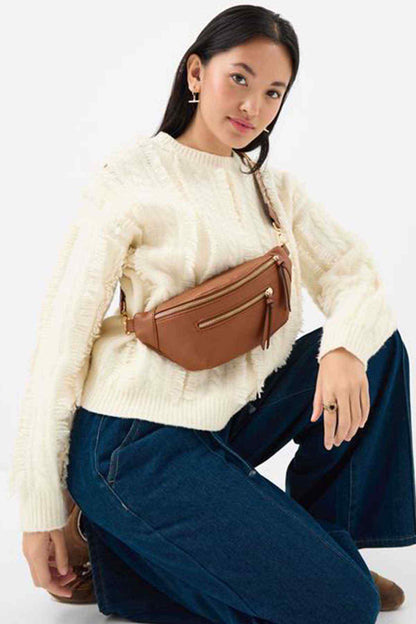 Tan belt bag with crossbody strap and zipped front pocket