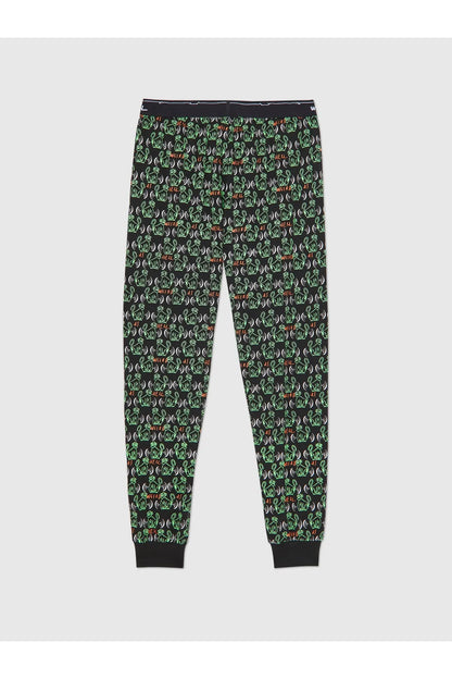 Black jogger pants with all-over green and red logo icons, elastic waist