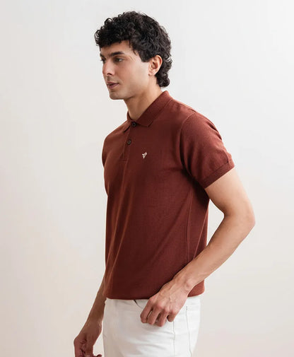 Fitted dark brown short-sleeve polo shirt, side front view with chest emblem