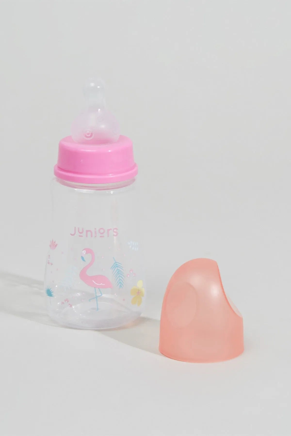 BABYSHOP junior baby bottle with pink flip-top, protective cap, and clear body