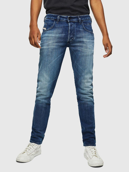 Blue denim jeans with straight-leg fit, button fly, and five-pocket design.