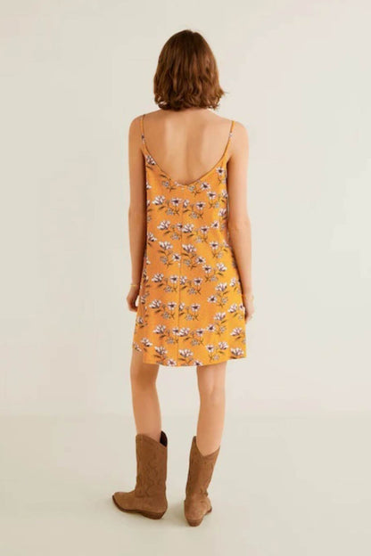 Mustard floral slip dress, back view with thin spaghetti straps and sleeveless V-neck