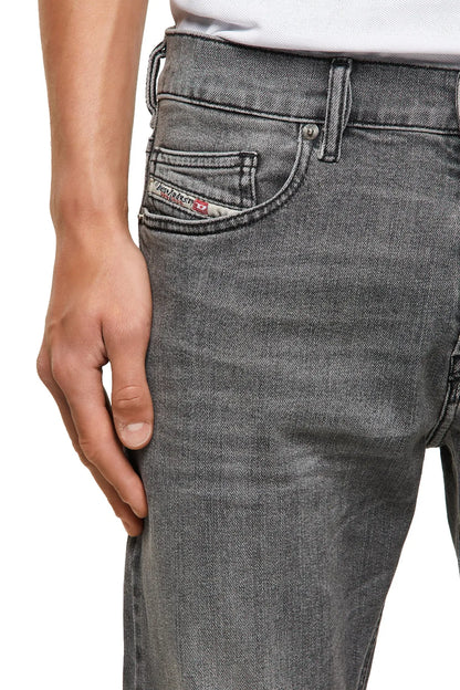 Light gray denim jeans with front coin pocket, belt loops, and button closure