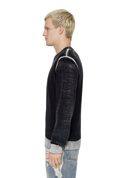 Black crewneck sweater side view with gray ribbed cuffs and hem band
