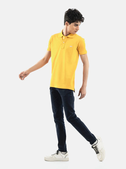 Yellow cotton polo shirt, short sleeves, collared neckline, chest logo