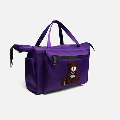 Purple tote bag with teddy bear front patch and dual top handles