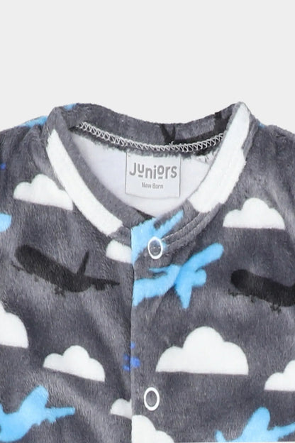 Grey baby romper close-up: snap buttons, cloud and airplane pattern with Juniors label
