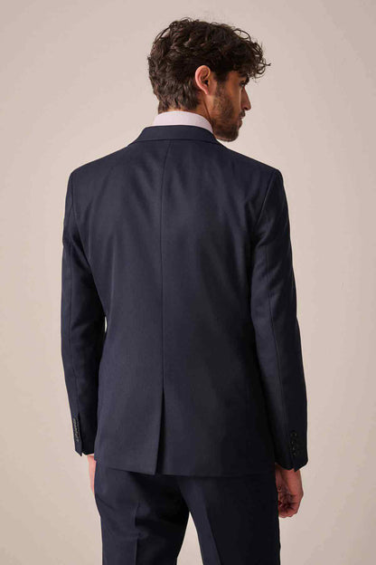 Men's navy suit jacket back view with center vent