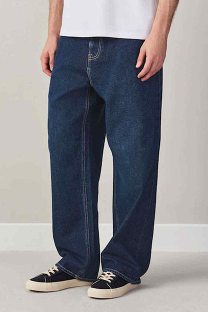 Dark blue straight-leg jeans with stitched seams and button fly