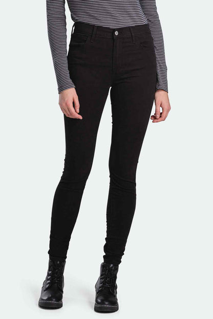 Black skinny jeans front view with button closure and slim legs.