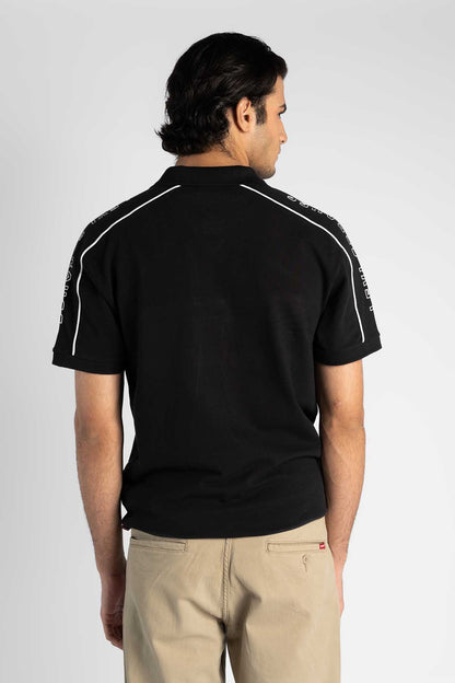 Levi's black polo shirt, back view with white stripe trim on shoulders