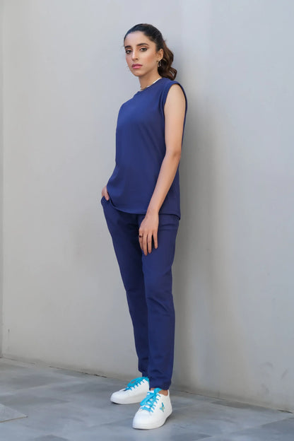 Navy sleeveless crew-neck top with matching high-waist trousers