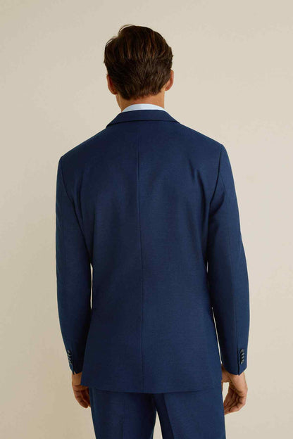 Men's navy blue suit jacket back view with center seam and single vent at hem