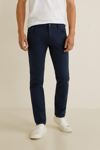 Dark navy denim jeans with button-zip fly and five-pocket styling