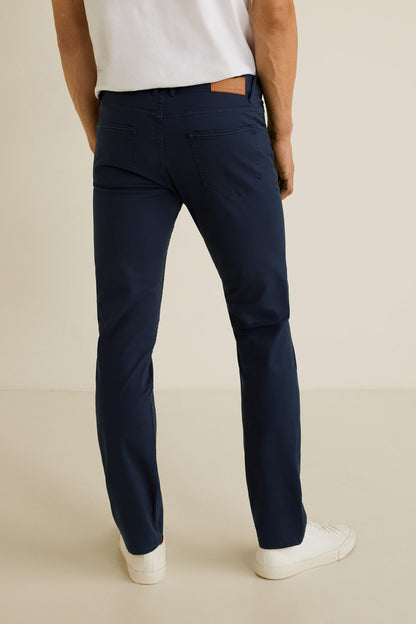 Dark navy slim-fit denim jeans with belt loops and tapered legs