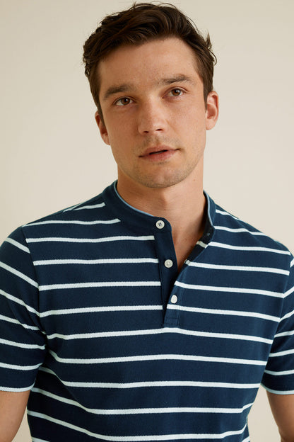 Men's dark navy striped polo shirt close-up of button placket and collar