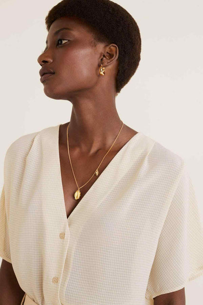 Beige textured V-neck button-front blouse with short sleeves