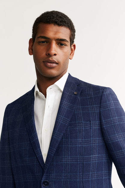 Blue plaid blazer close-up with notch lapels and front button