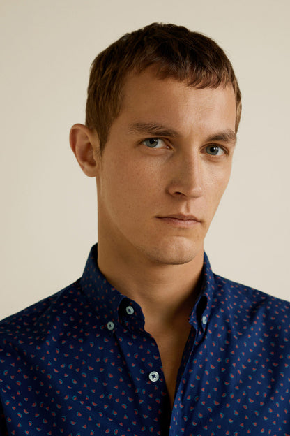 Men's dark navy patterned button-up shirt detail: collar and buttons