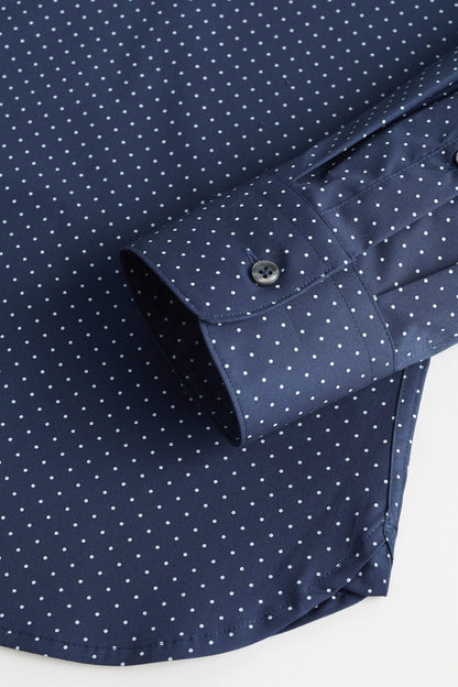 Dark navy dotted shirt close-up: buttoned cuff and placket detail