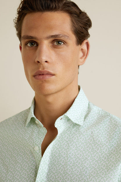 Light green patterned dress shirt with button placket and spread collar