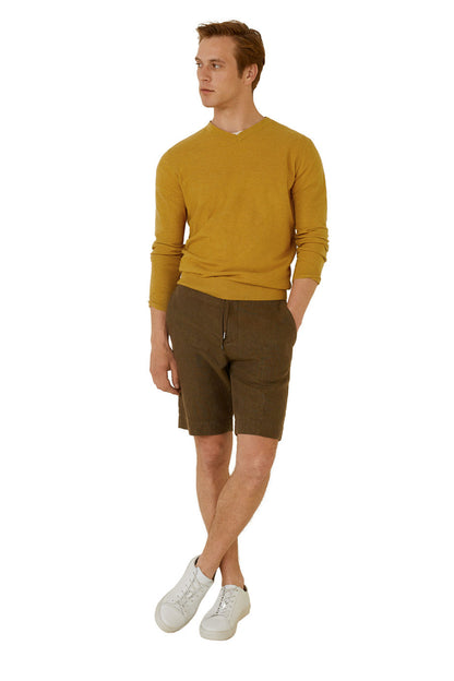 Mustard yellow V-neck knit sweater with long sleeves and ribbed hem