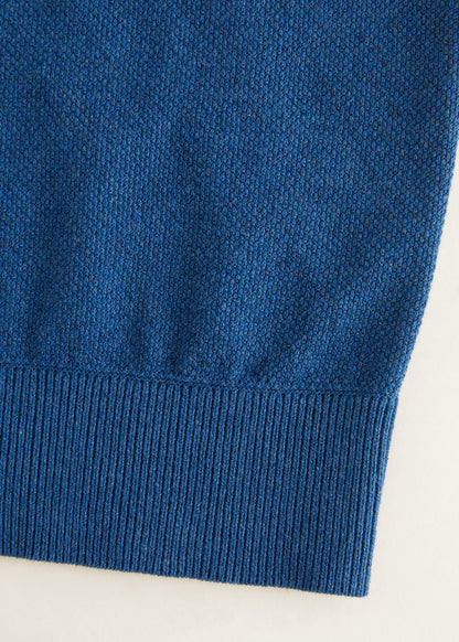 Indigo blue knit sweater hem with ribbed trim