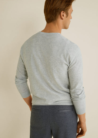 Light heather grey crewneck knit sweater, back view, long sleeves and ribbed hem